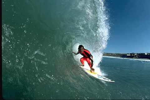 Original photo: A surfer riding inside a turquoise wave.